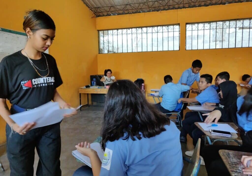 Helen works with students on overcoming obstacles.