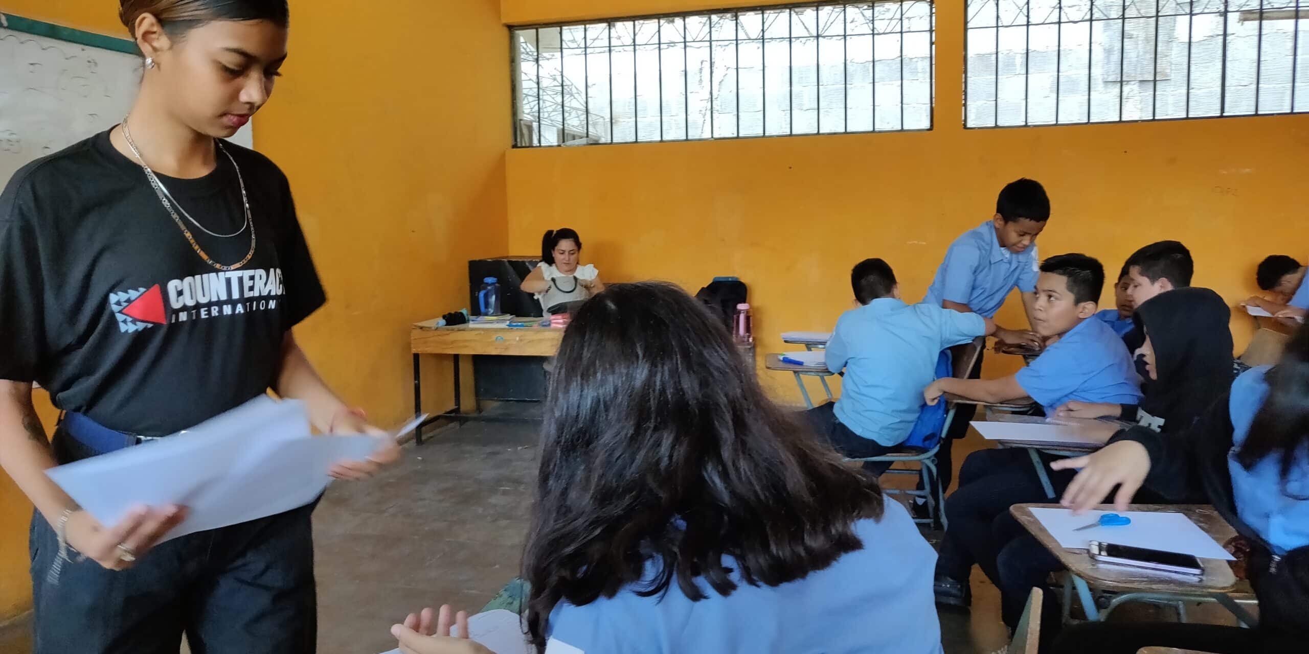 Helen works with students on overcoming obstacles.